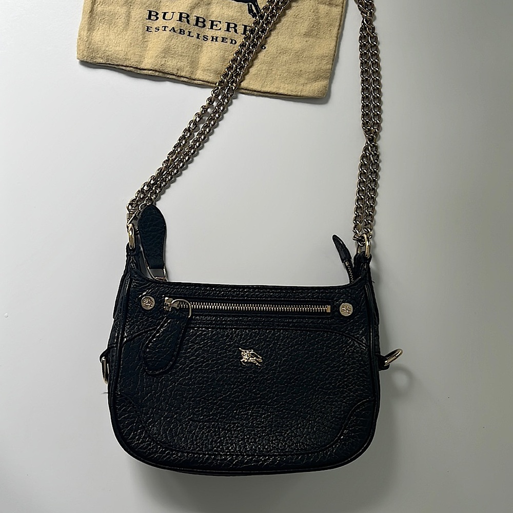 Burberry Black pebbled leather purse with gold tone hardware and chain strap